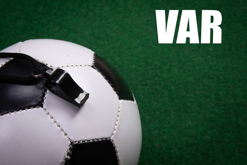 Football, whistle and VAR lettering